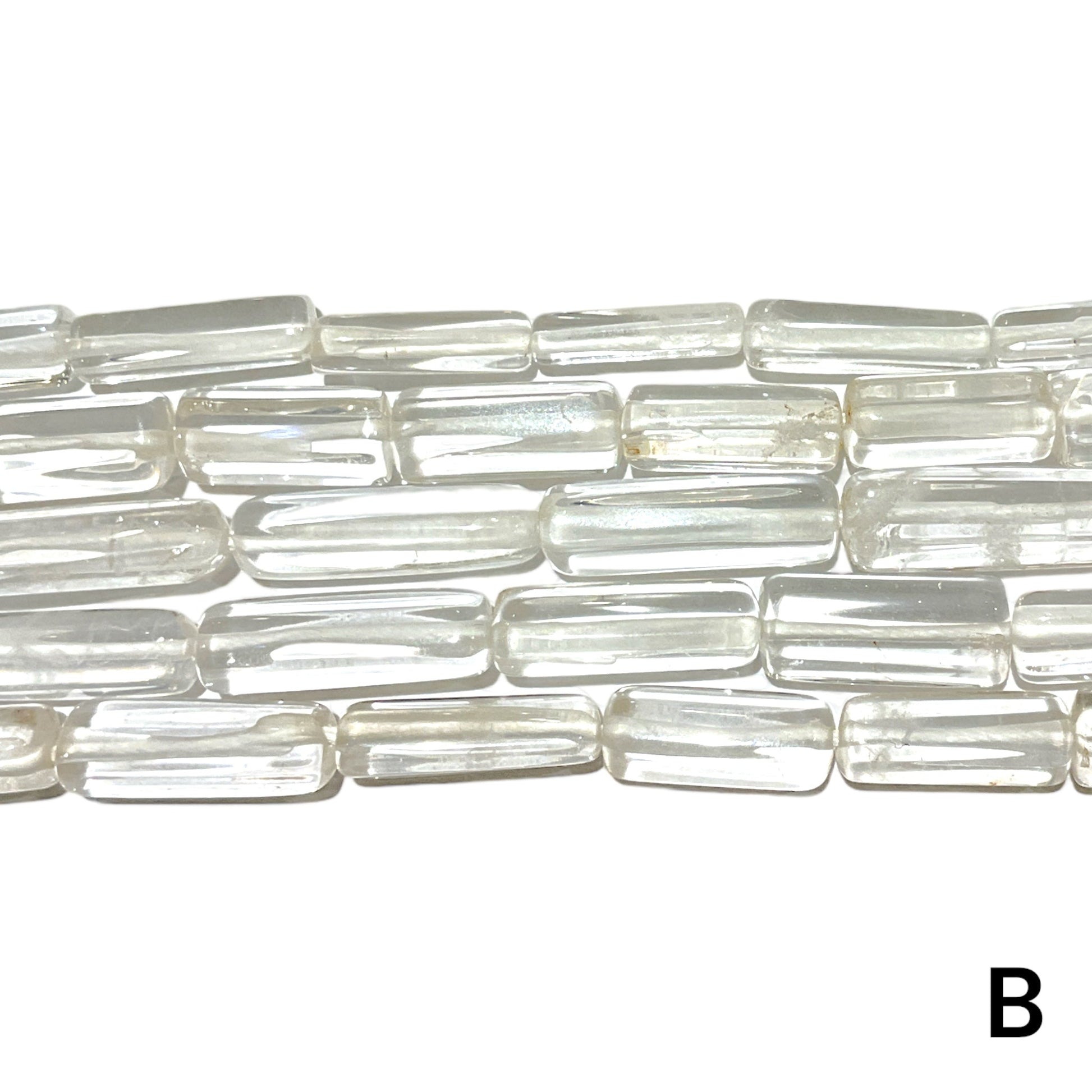 Fil de perles Cristal de roche forme allongé multiple variante A - Foliesbijoux