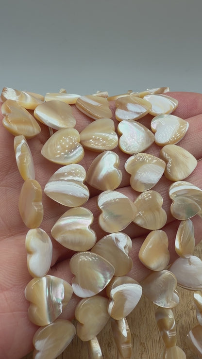12mm golden mother-of-pearl heart bead strand — horizontally drilled