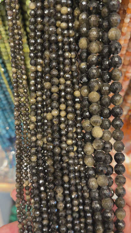 Fil de perles facettées obsidienne doré