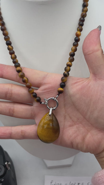 Collier boule en Œil de tigre A attache bouée en acier argenté avec pendentif